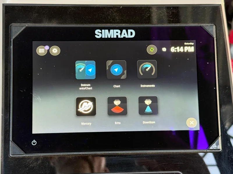 Slide: The Image of Simrad display on 2024 Barletta Corsa 23UC showing navigation and instrument apps. - 9