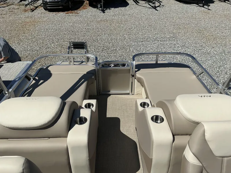 Slide: The Image of 2025 Avalon LSZ 23 FT Rear Lounger with beige seating and cup holders. - 4