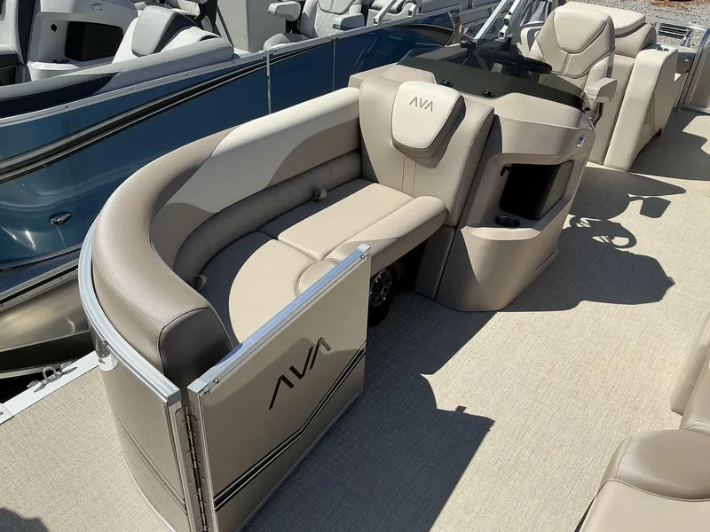 Slide: The Image of 2025 Avalon LSZ 23 FT Rear Lounger boat interior with beige seating and modern design. - 8