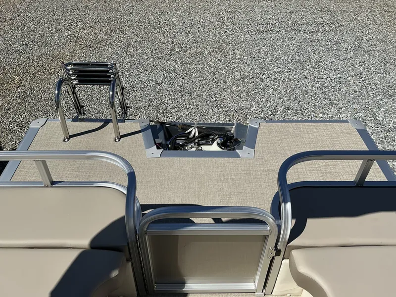 Slide: The Image of 2025 Avalon LSZ - 23 FT Rear Lounger boat with ladder and seating area. - 9