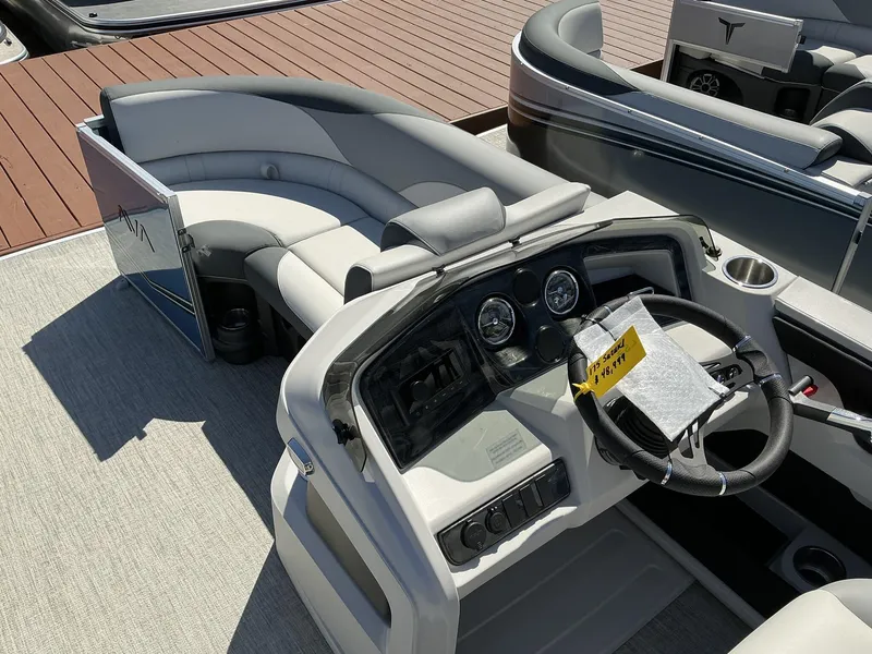 Slide: The Image of 2025 Avalon LSZ - 23 FT pontoon boat interior with steering console and seating. - 10