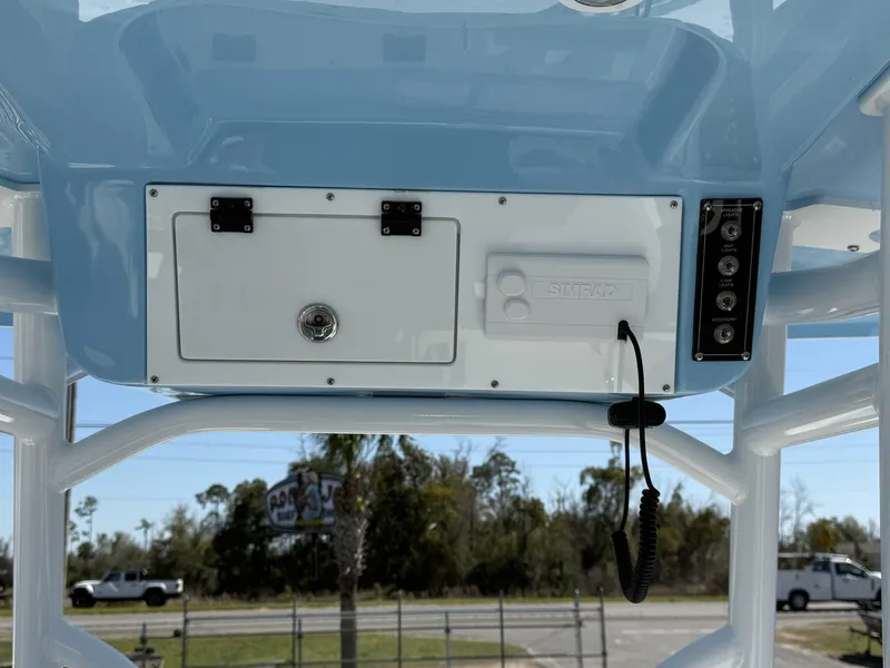 Slide: The Image of 2025 Sea Pro 225FLX SANDBAR boat console with Simrad electronics and accessory panel. - 10