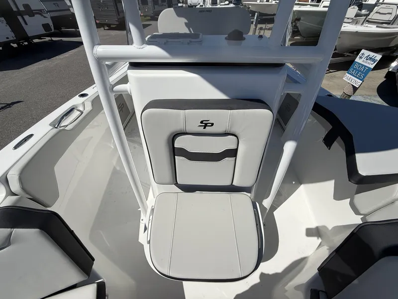 Slide: The Image of 2025 Sea Pro 225FLX SANDBAR boat interior with seating and storage compartments. - 8