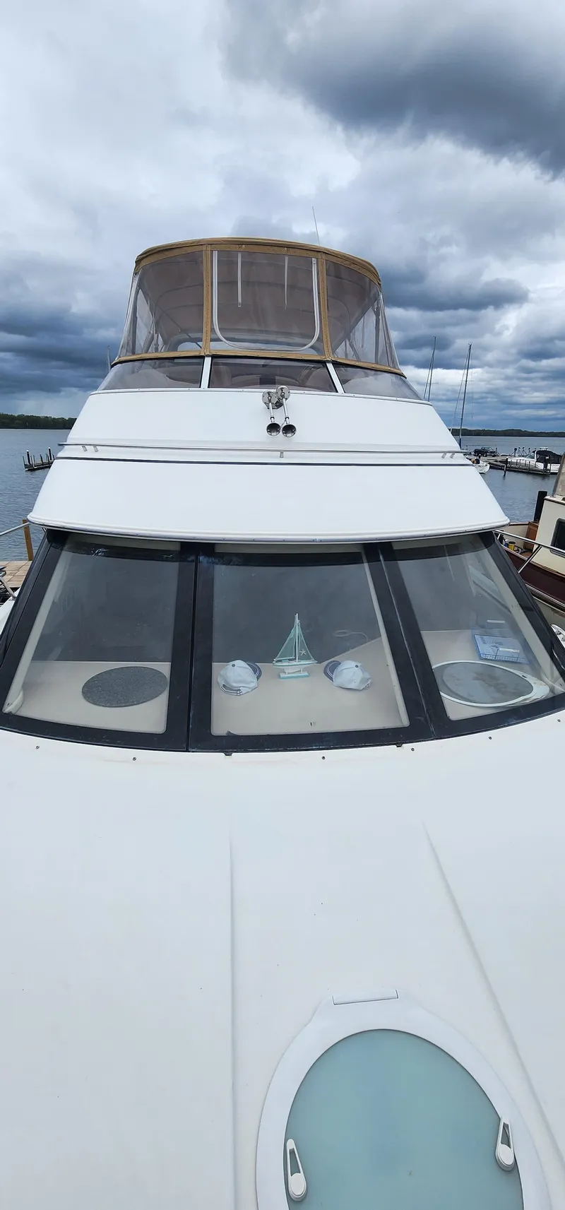 Slide: The Image of 2006 Carver 36 Aft Cabin Motor Yacht with cloudy sky backdrop. - 11