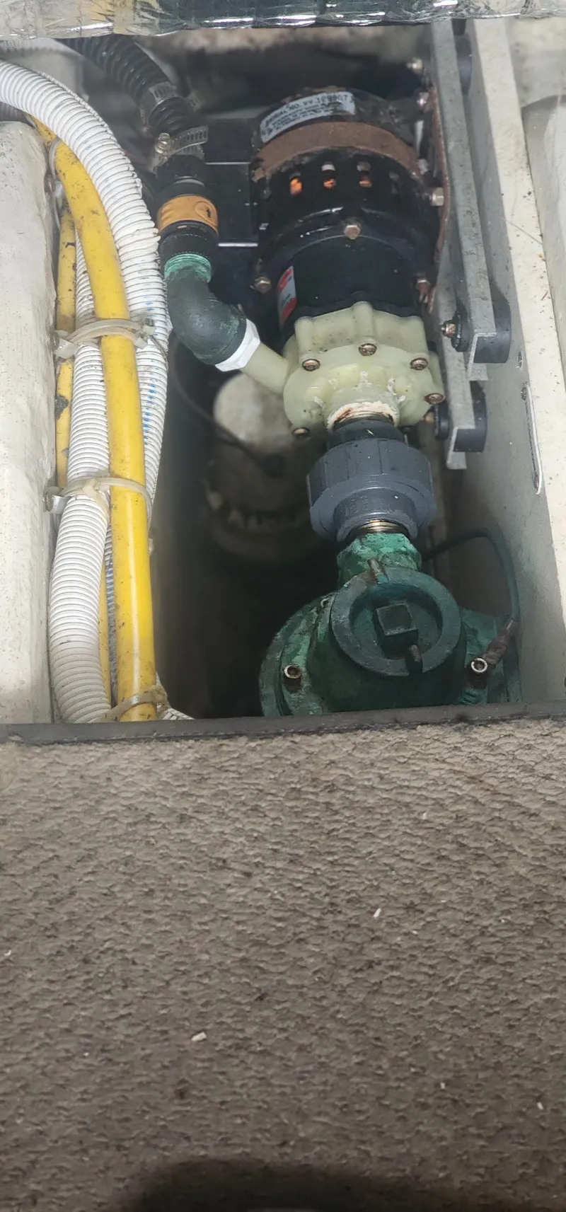 Slide: The Image of Engine compartment of 2006 Carver 36 Aft Cabin Motor Yacht with visible hoses and components. - 14