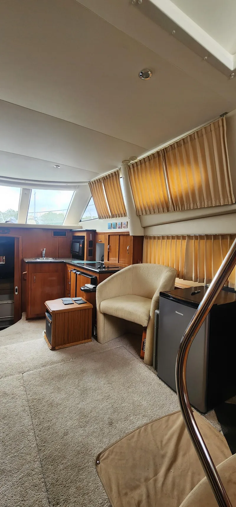 Slide: The Image of Interior of 2006 Carver 36 Aft Cabin Motor Yacht with cozy seating and kitchenette. - 17