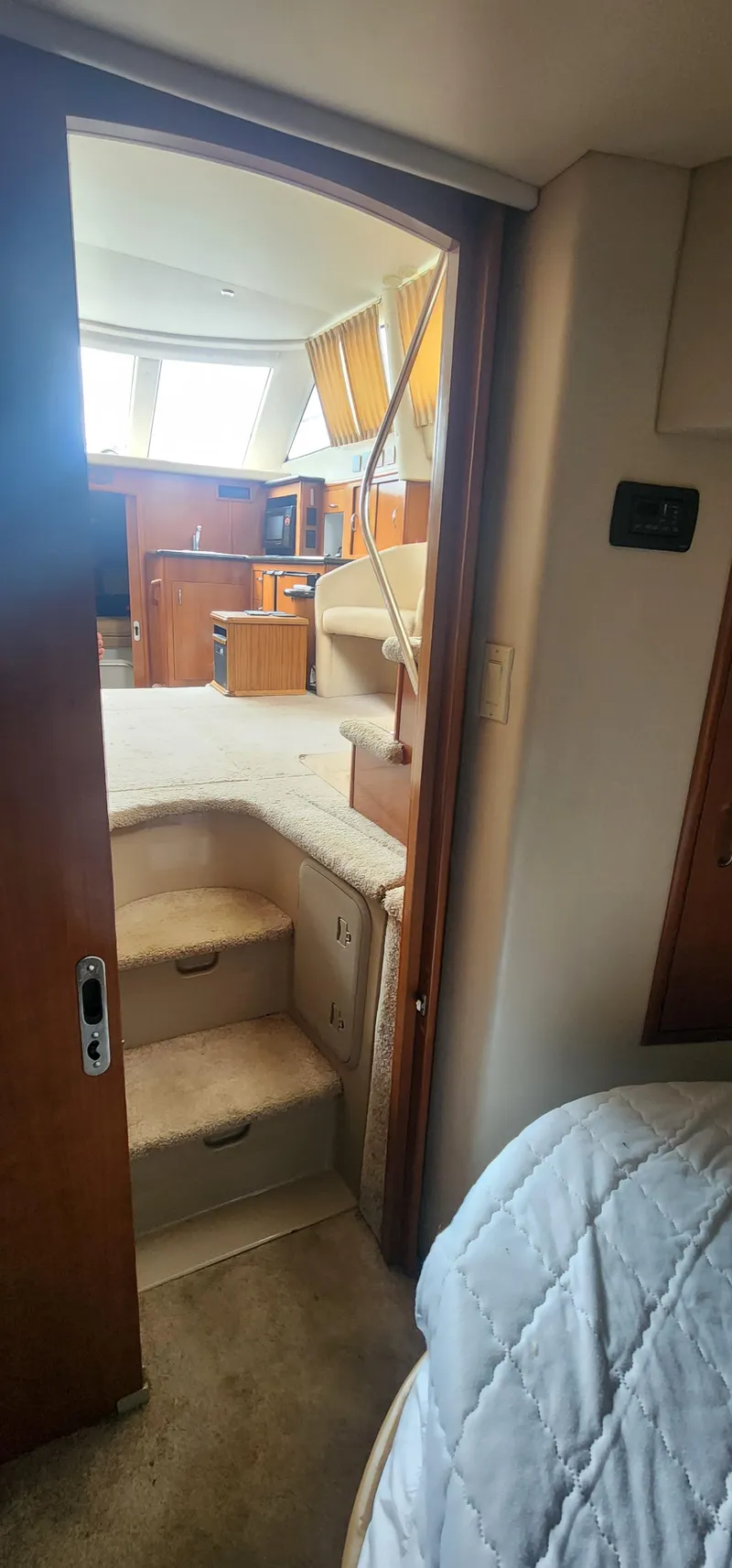 Slide: The Image of Interior view of 2006 Carver 36 Aft Cabin Motor Yacht, featuring cozy cabin and steps. - 18