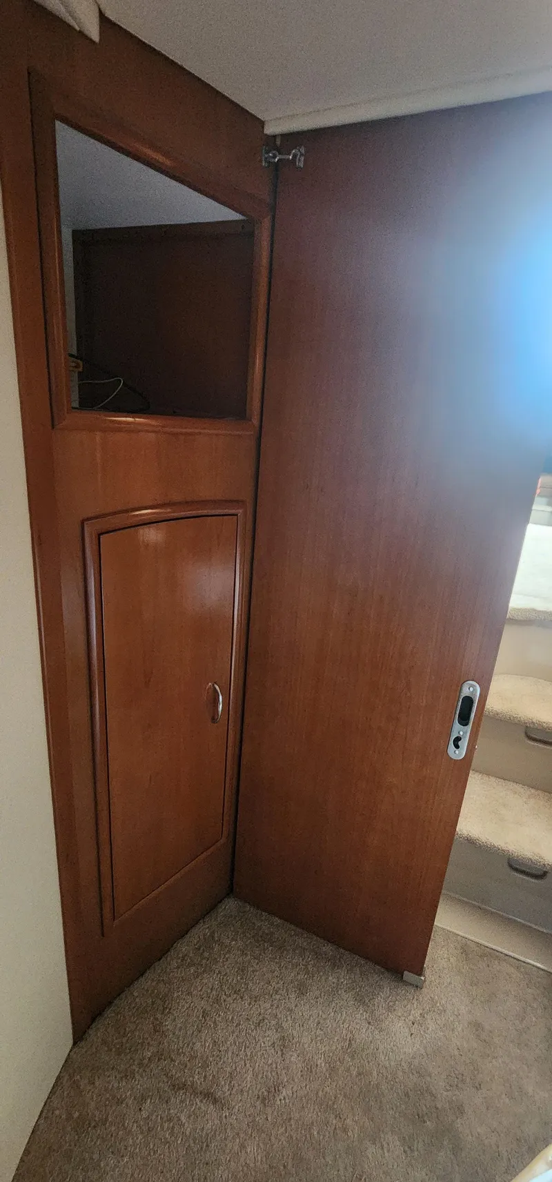 Slide: The Image of 2006 Carver 36 Aft Cabin Motor Yacht interior with wooden cabinetry and carpeted stairs. - 19