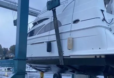 Slide: The Image of 2006 Carver 36 Aft Cabin Motor Yacht being lifted at a marina. - 3