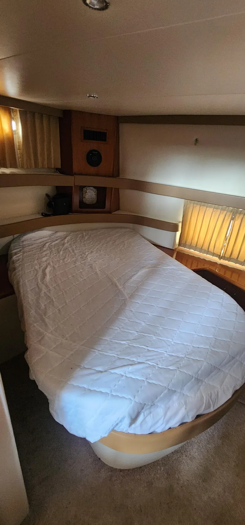 Slide: The Image of 2006 Carver 36 Aft Cabin Motor Yacht bedroom with cozy bed and wooden accents. - 32