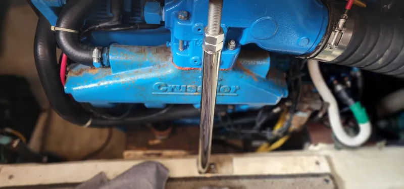 Slide: The Image of Engine compartment of 2006 Carver 36 Aft Cabin Motor Yacht, featuring blue Crusader engine. - 35