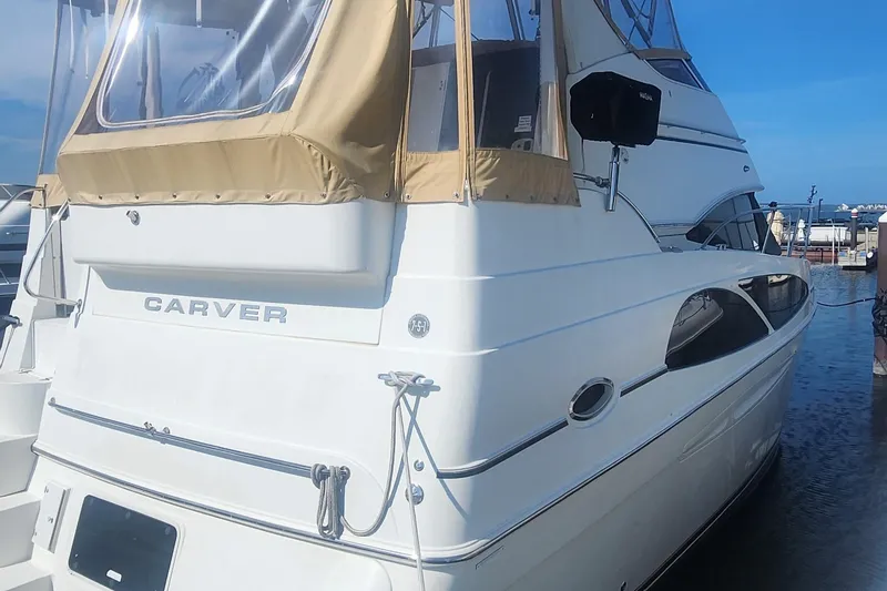 Slide: The Image of 2006 Carver 36 Aft Cabin Motor Yacht docked at marina. - 37