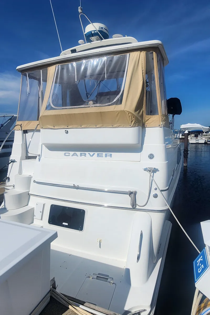 Slide: The Image of 2006 Carver 36 Aft Cabin Motor Yacht docked at marina. - 1