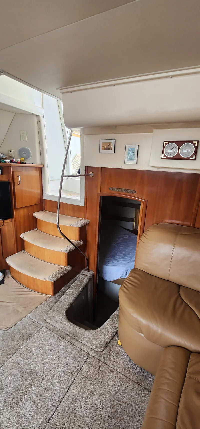 Slide: The Image of Interior of 2006 Carver 36 Aft Cabin Motor Yacht with cozy seating and wooden stairs. - 15