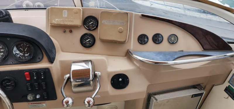 Slide: The Image of Control panel of a 2006 Carver 36 Aft Cabin Motor Yacht with gauges and controls. - 21