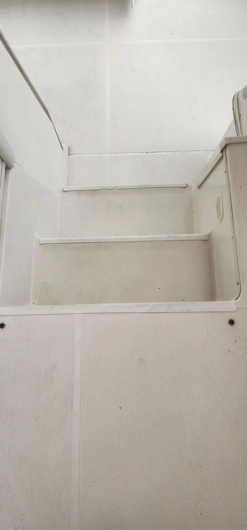 Slide: The Image of Stairs inside a 2006 Carver 36 Aft Cabin Motor Yacht, featuring a clean, white design. - 23