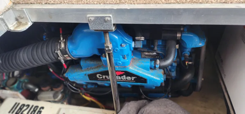 Slide: The Image of Engine compartment of a 2006 Carver 36 Aft Cabin Motor Yacht with a blue Crusader engine. - 34