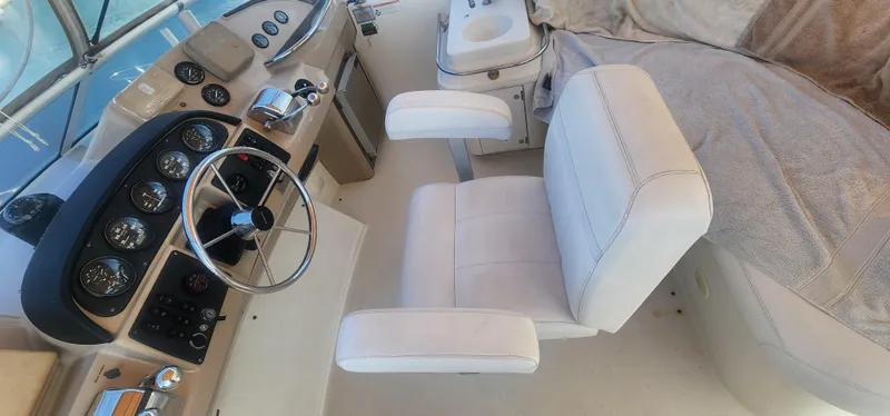 Slide: The Image of Interior helm of 2006 Carver 36 Aft Cabin Motor Yacht with white captain's chair. - 39