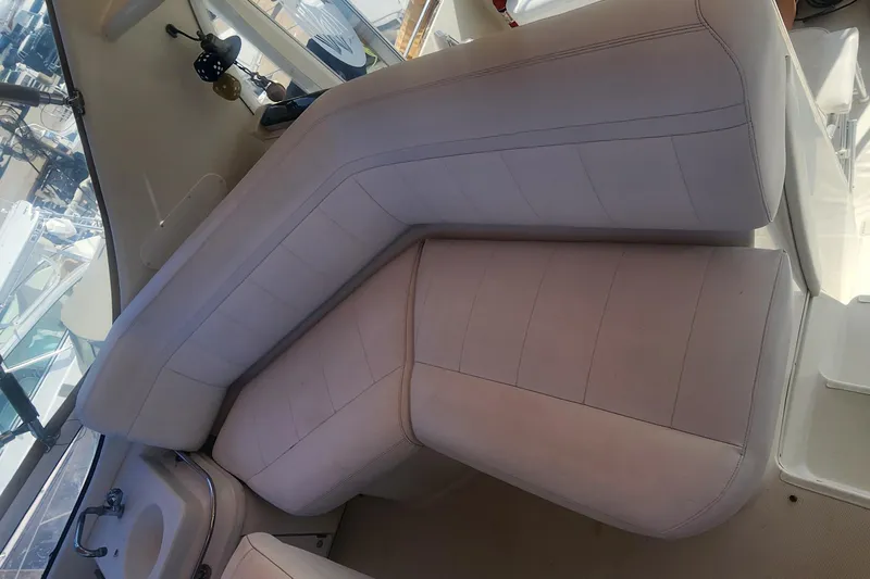 Slide: The Image of 2006 Carver 36 Aft Cabin Motor Yacht interior seating area with white upholstery. - 43