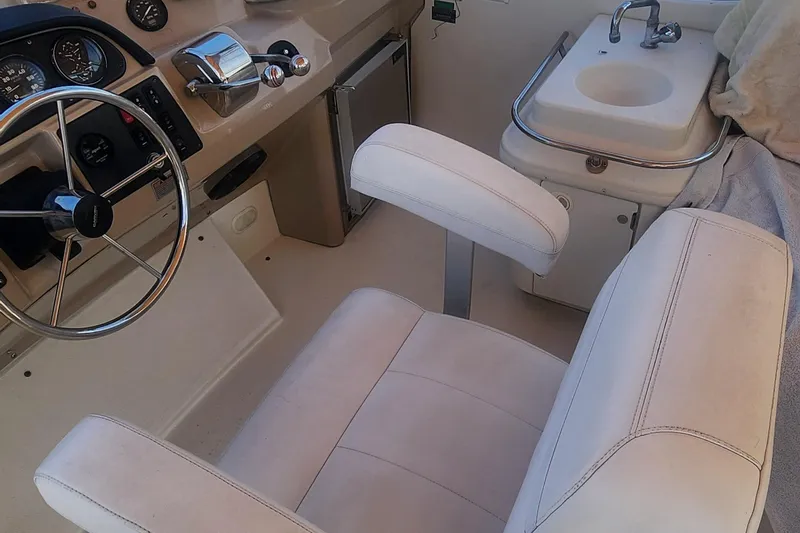 Slide: The Image of Helm of 2006 Carver 36 Aft Cabin Motor Yacht with steering wheel and sink. - 44
