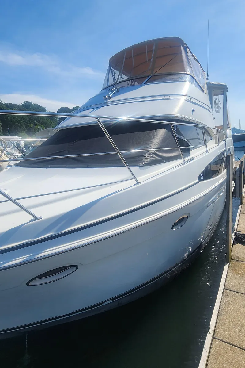 Slide: The Image of 2006 Carver 36 Aft Cabin Motor Yacht docked on a sunny day. - 46