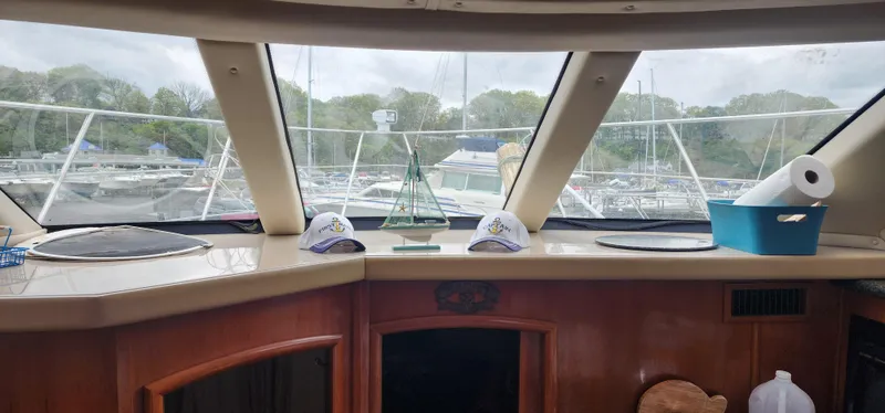 Slide: The Image of Interior view of 2006 Carver 36 Aft Cabin Motor Yacht with marina in background. - 7