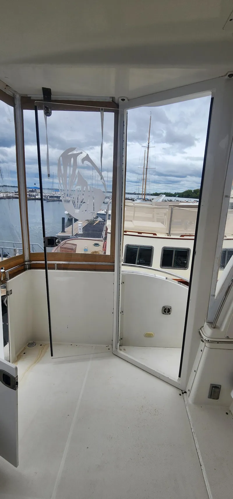 Slide: The Image of 2006 Carver 36 Aft Cabin Motor Yacht interior with marina view. - 8