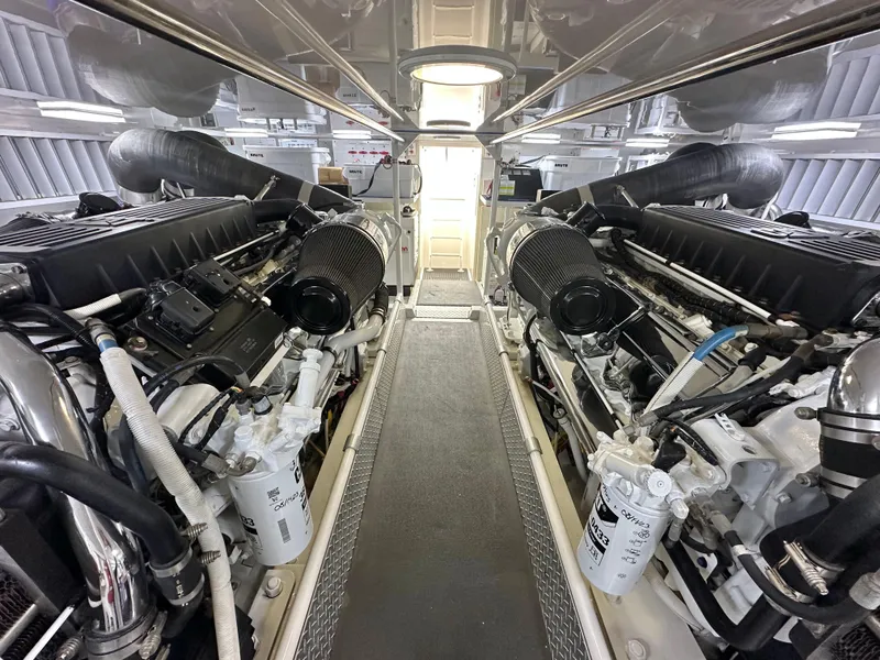 Slide: The Image of Engine room of 2008 Viking 64 Enclosed Bridge yacht, showcasing dual engines. - 14