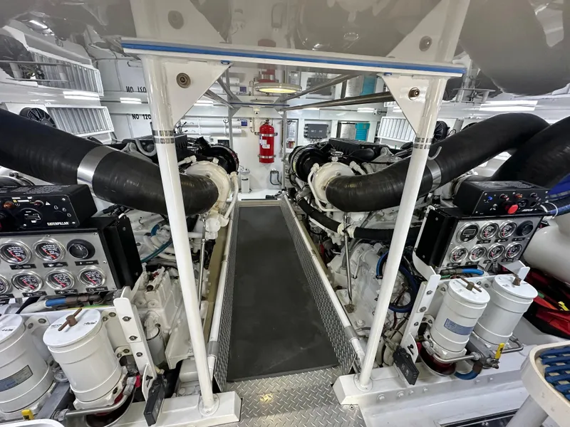 Slide: The Image of Engine room of 2008 Viking 64 Enclosed Bridge yacht, showcasing dual engines and equipment. - 20