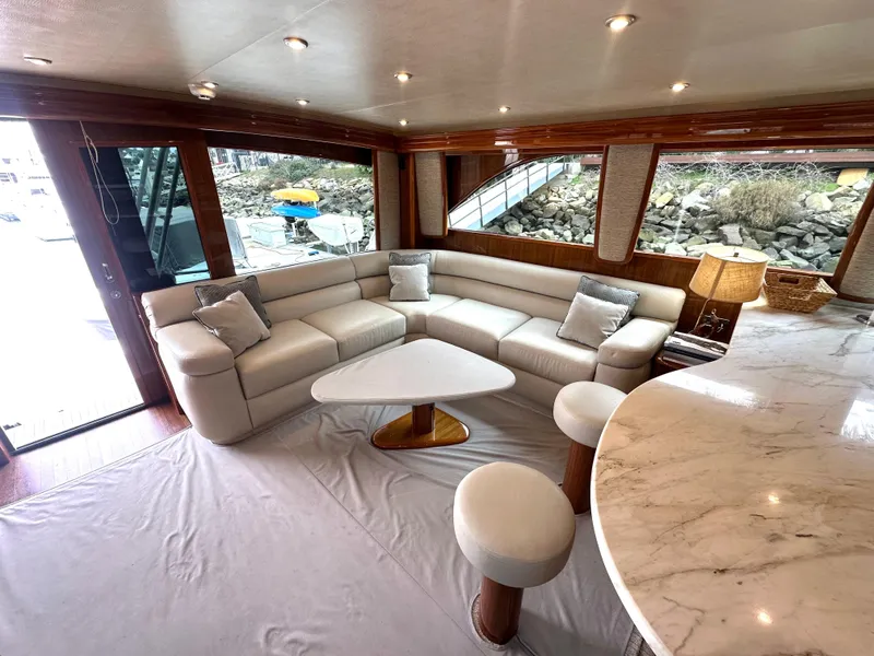 Slide: The Image of Luxurious interior of 2008 Viking 64 Enclosed Bridge yacht with elegant seating and marble table. - 32
