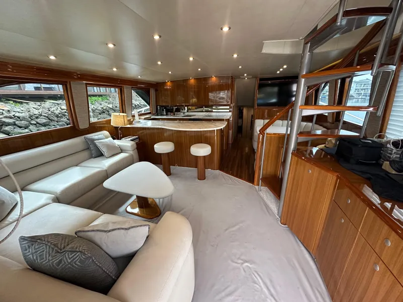 Slide: The Image of Luxurious interior of 2008 Viking 64 Enclosed Bridge yacht with modern furnishings and wood accents. - 34