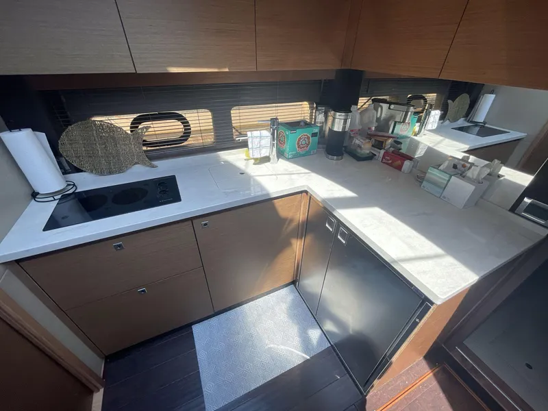 Slide: The Image of Modern kitchen in 2016 Sea Ray 470 Sundancer yacht with sleek countertops and appliances. - 17