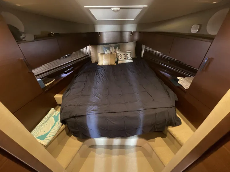 Slide: The Image of Luxurious cabin interior of 2016 Sea Ray 470 Sundancer yacht with cozy bedding. - 20