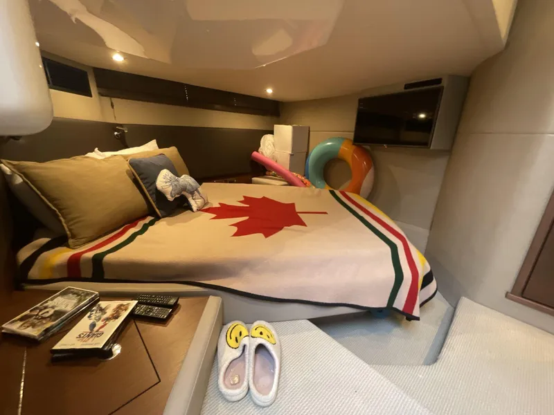 Slide: The Image of Cozy cabin interior of 2016 Sea Ray 470 Sundancer with Canadian-themed bedding. - 23