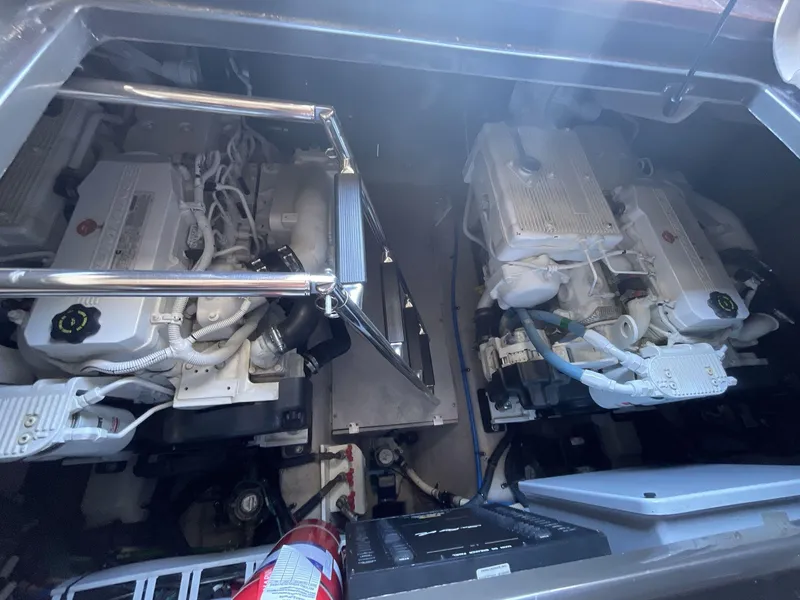 Slide: The Image of Engine compartment of 2016 Sea Ray 470 Sundancer with visible machinery and components. - 27