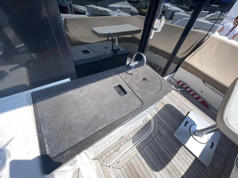Slide: The Image of 2016 Sea Ray 470 Sundancer yacht deck with seating and table. - 6