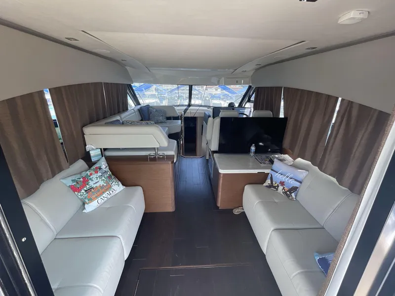 Slide: The Image of Interior of 2016 Sea Ray 470 Sundancer yacht with modern seating and decor. - 7