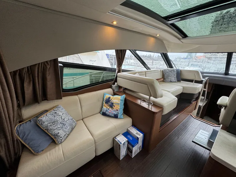 Slide: The Image of Luxurious interior of 2016 Sea Ray 470 Sundancer yacht with plush seating and elegant decor. - 8