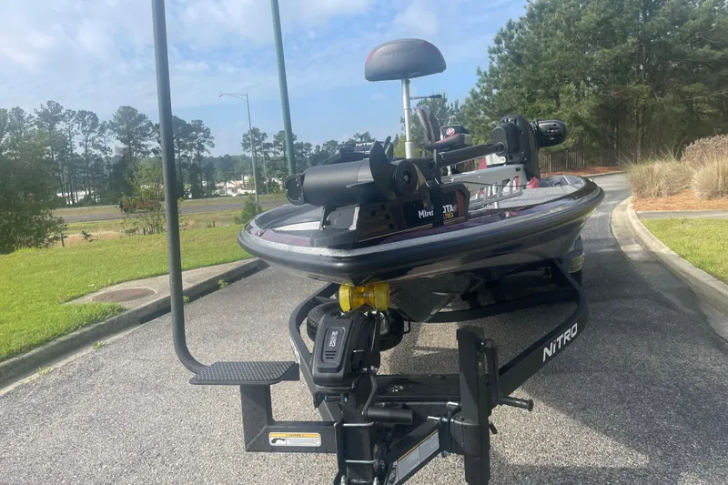 Slide: The Image of 2025 Nitro Z21 XL Pro boat on a trailer, parked on a sunny day. - 96