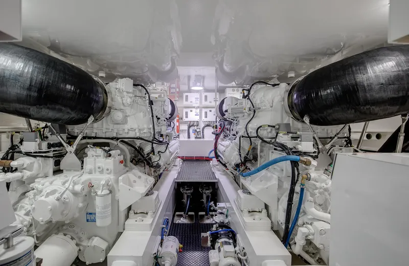 Slide: The Image of Engine room of 2019 Viking 62 Convertible yacht, showcasing dual engines and mechanical systems. - 35