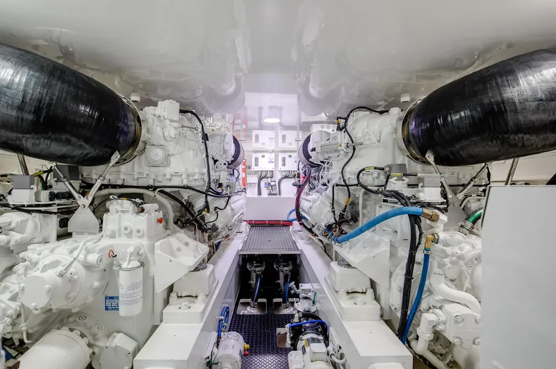 Slide: The Image of Engine room of 2019 Viking 62 Convertible yacht, showcasing dual engines and mechanical systems. - 36