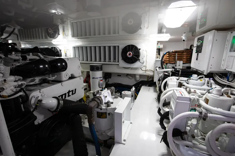 Slide: The Image of Engine room of 2019 Viking 62 Convertible yacht, featuring advanced machinery and equipment. - 37