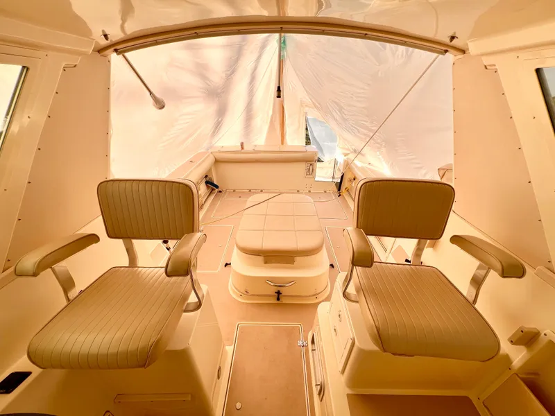 Slide: The Image of Interior of 2000 Albin 28 Tournament Express boat with seating and helm area. - 16