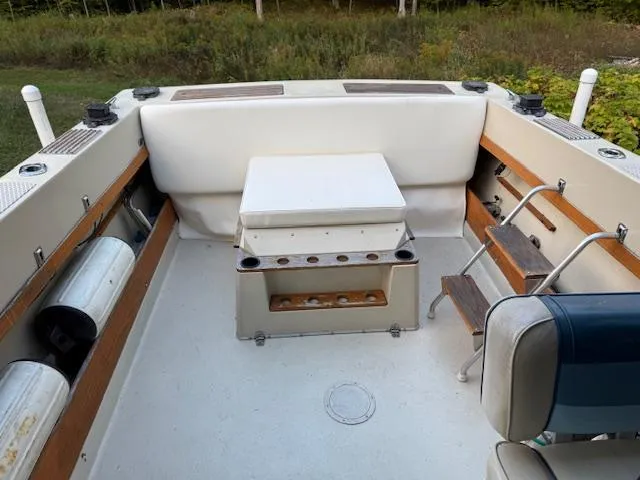 Slide: The Image of 1990 Thompson 240 Fisherman boat interior with seating and storage compartments. - 12