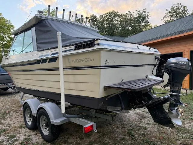 Slide: The Image of 1990 Thompson 240 Fisherman boat on trailer with Yamaha outboard motor. - 7