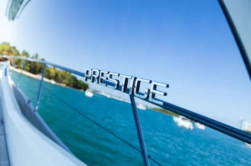 Slide: The Image of Prestige 560 Flybridge yacht, 2018 model, cruising on clear blue waters. - 15