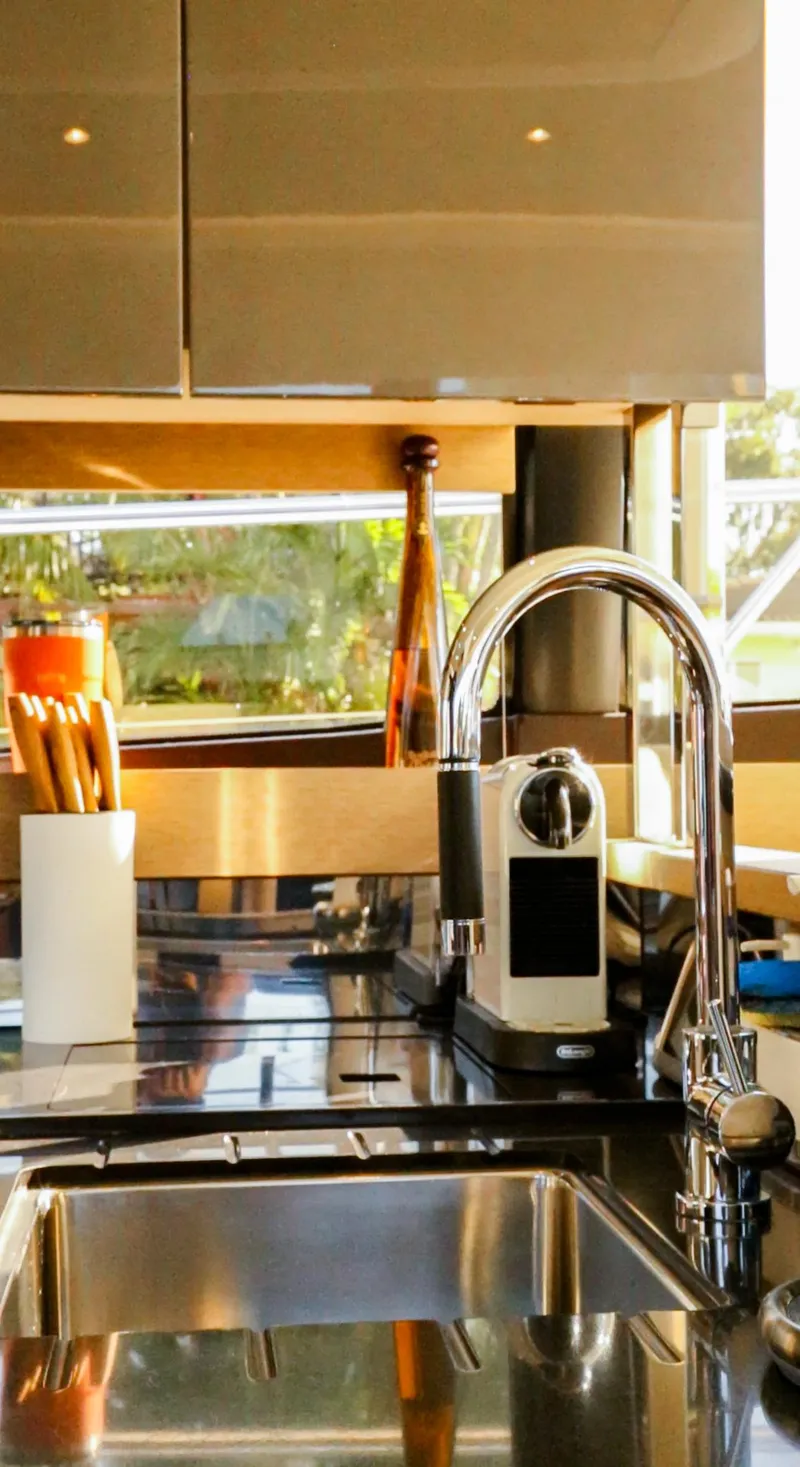 Slide: The Image of Modern kitchen interior on 2018 Prestige 560 Flybridge yacht, featuring sleek design and amenities. - 19