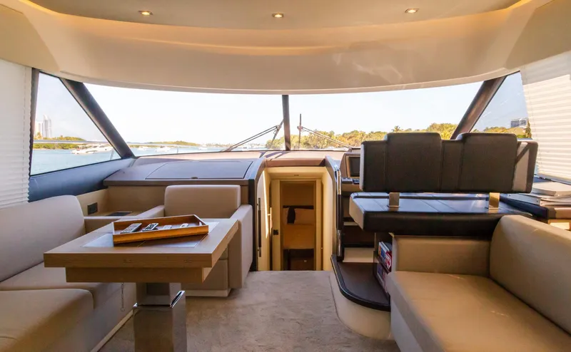 Slide: The Image of Interior of 2018 Prestige 560 Flybridge yacht, featuring luxurious seating and modern design. - 22