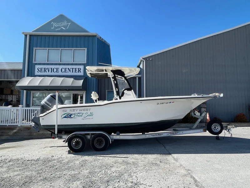The Image of 2019 Key West 244 Center Console boat on trailer outside service center. - 0