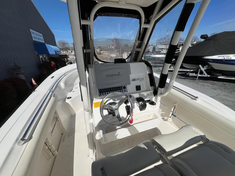 Slide: The Image of 2019 Key West 244 Center Console boat interior with Garmin navigation system. - 12